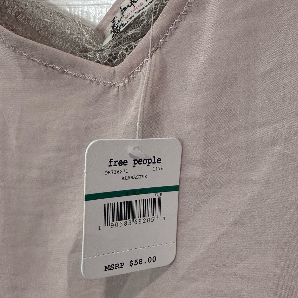Free People lightweight camisole with beautiful lace detailing underneath.